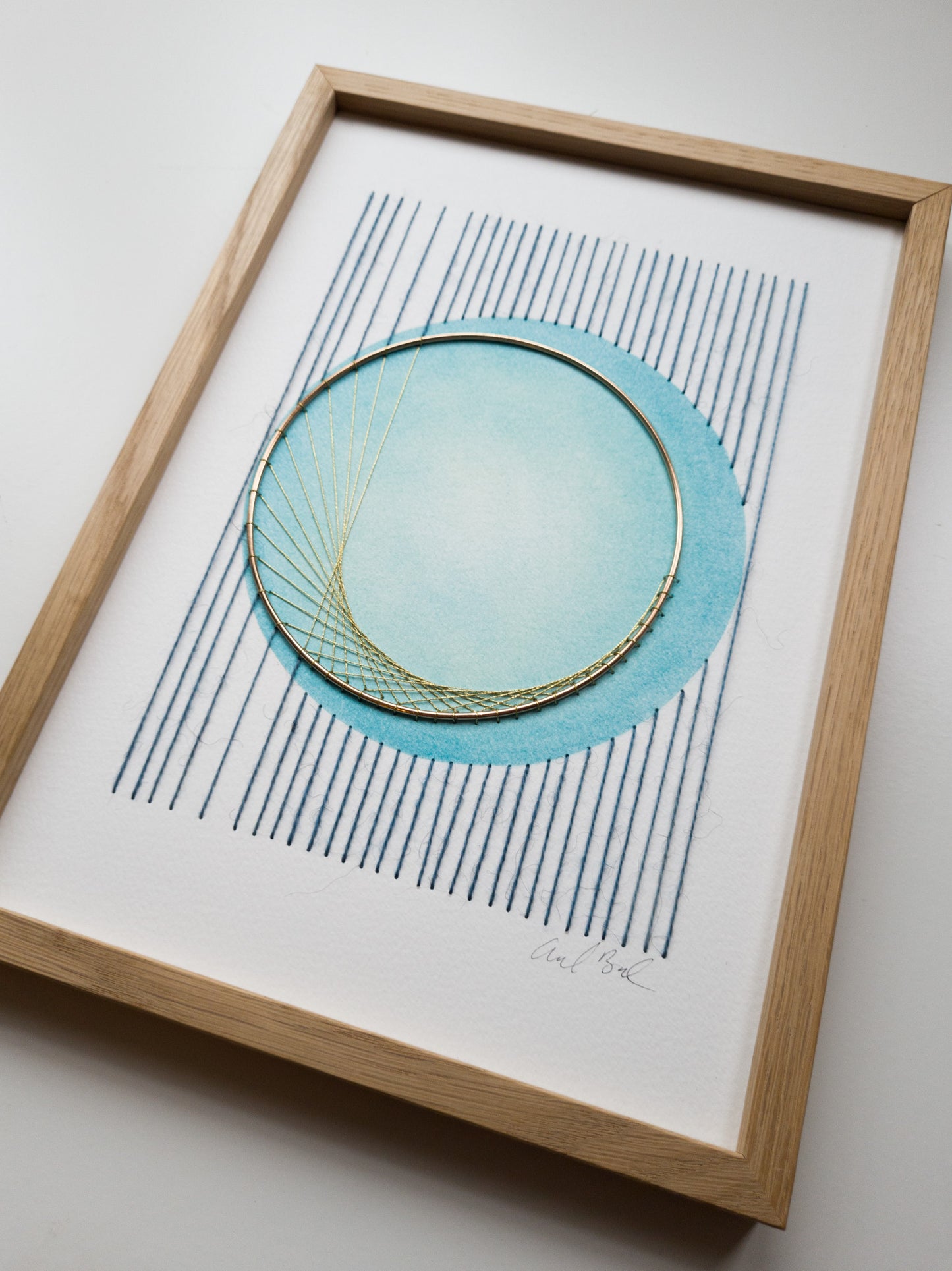 paper Embroidery - blue with brass ring - cirkel - seen from an ankel
